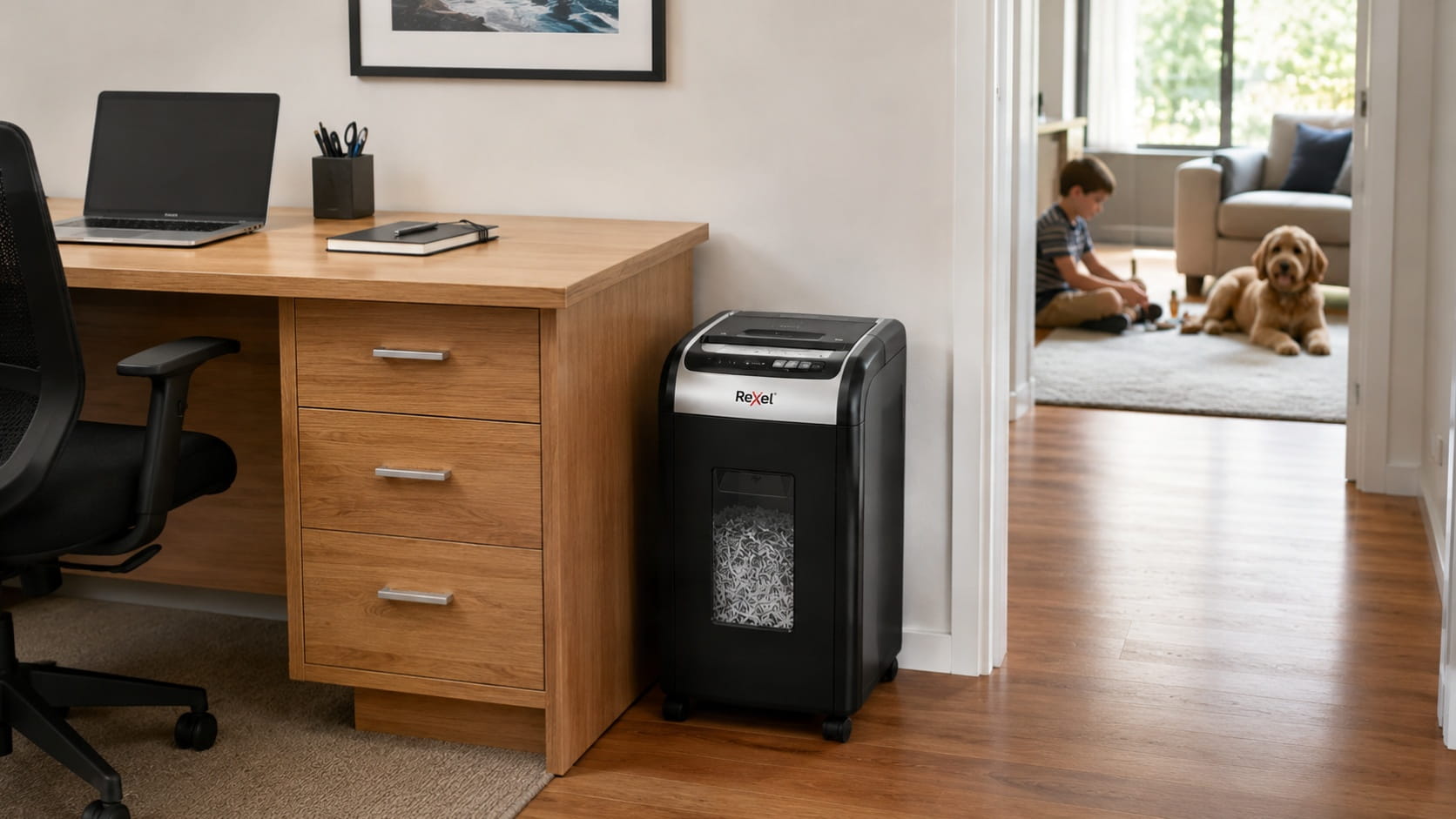 Paper shredder positioned safely in a home office away from a child and household pet